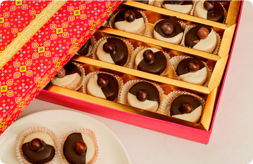 Assorted gift boxes filled with Indian sweets and namkeen